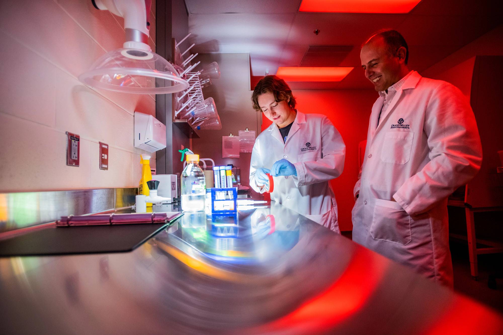 A GVSU student studies with a professor in one of Grand Valley's science labs.